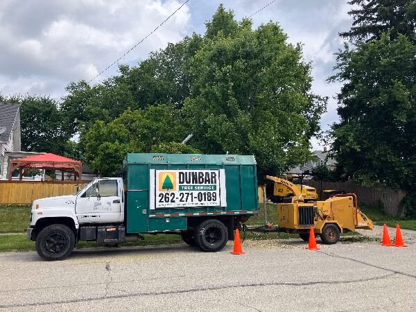 Dunbar Tree Services chipper truck and equipment for professional tree removal and trimming in Waukesha